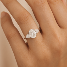 Platinum Oval And Pear 1.70ct Lab Diamond 3 Stone Ring