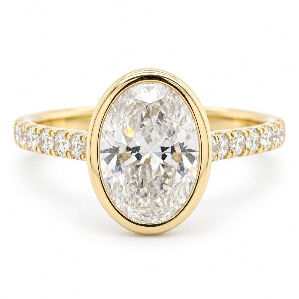 982636-2.35ct 9ct Yellow Gold 2.00ct Centre 0.35cts Sides Bezel Oval Bezel Set Solitaire Ring Front Image 982636-2.35ct 9ct Yellow Gold 2.00ct Centre 0.35cts Sides Bezel Oval Bezel Set Solitaire Ring Front Image